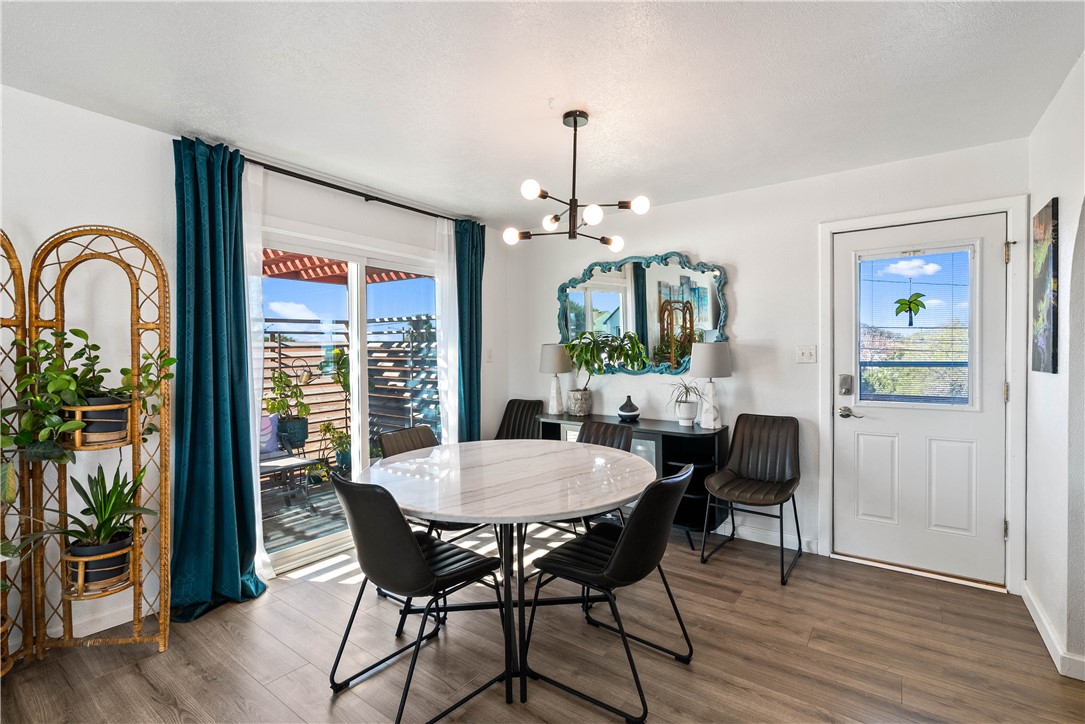 3211 Laguna Shores Road Corpus Christi, TX 78418 - Photo 13 of 29 a view of a dining room with furniture window and wooden floor