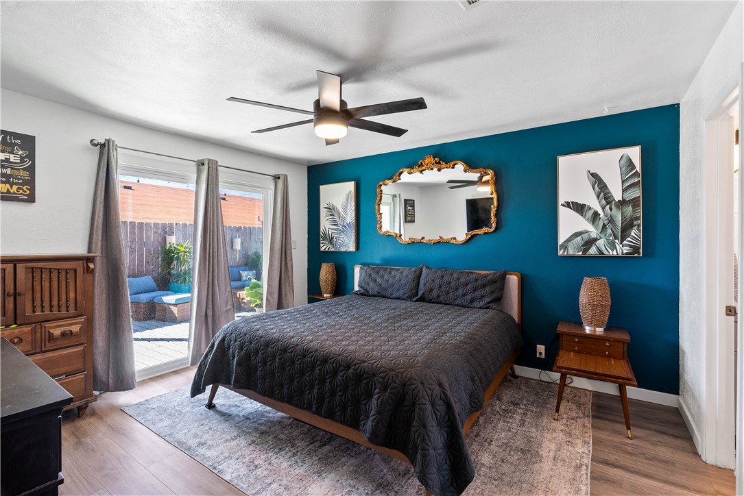 3211 Laguna Shores Road Corpus Christi, TX 78418 - Photo 14 of 29 a bedroom with a bed and a chandelier