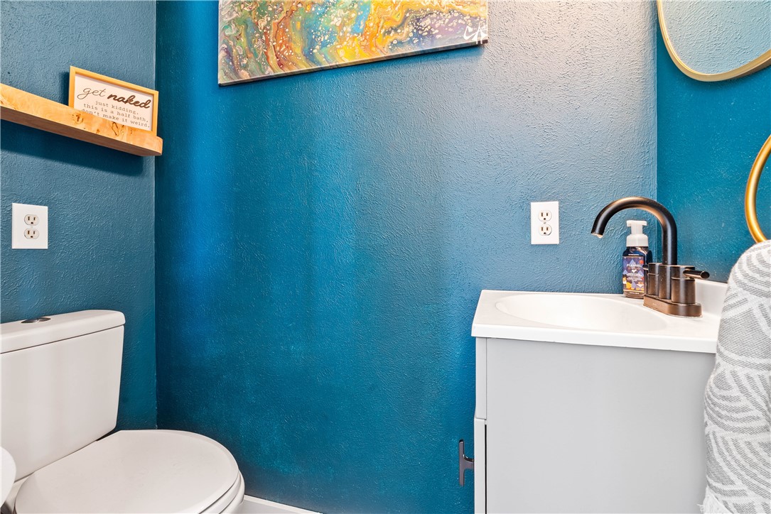 3211 Laguna Shores Road Corpus Christi, TX 78418 - Photo 18 of 29 a bathroom with a toilet sink and mirror