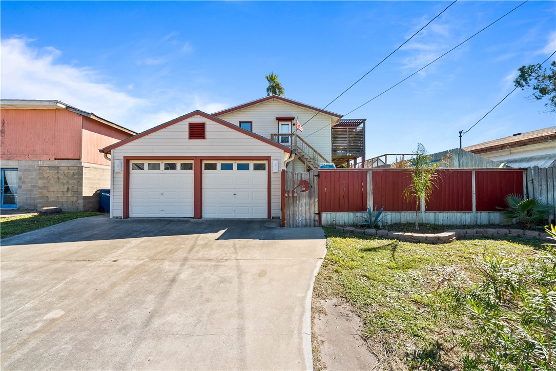 3211 Laguna Shores Road Corpus Christi, TX 78418 - Photo 2 of 29 a front view of a house with a yard
