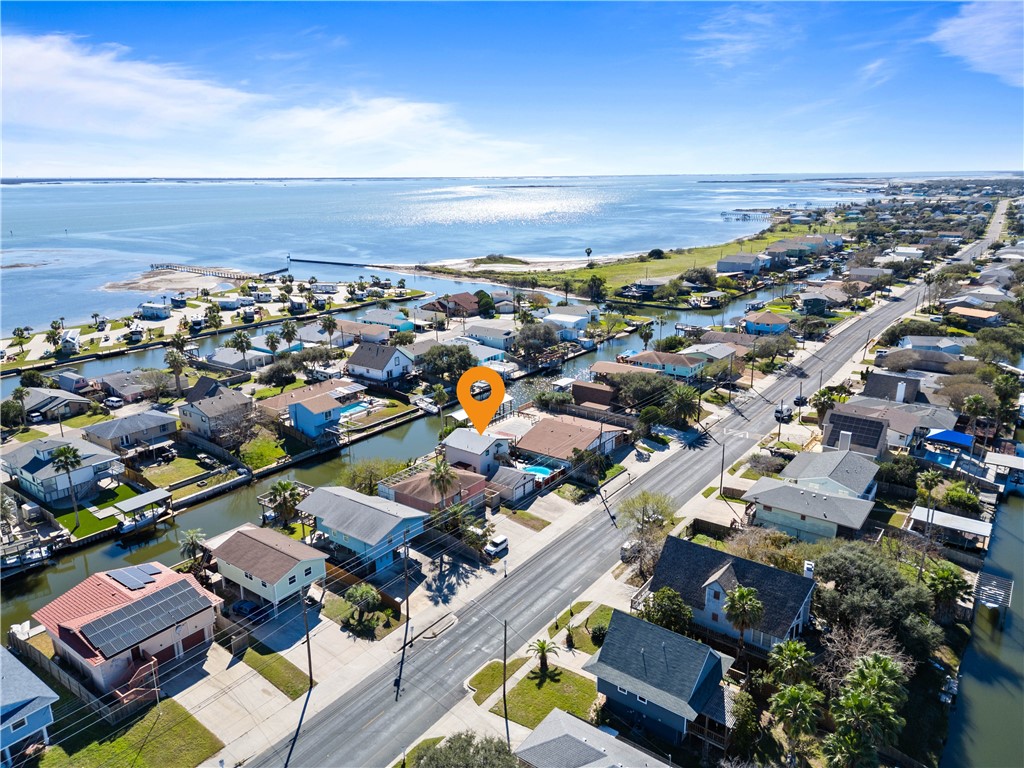 3211 Laguna Shores Road Corpus Christi, TX 78418 - Photo 21 of 29 an aerial view of a city with lots of residential buildings and ocean view in back