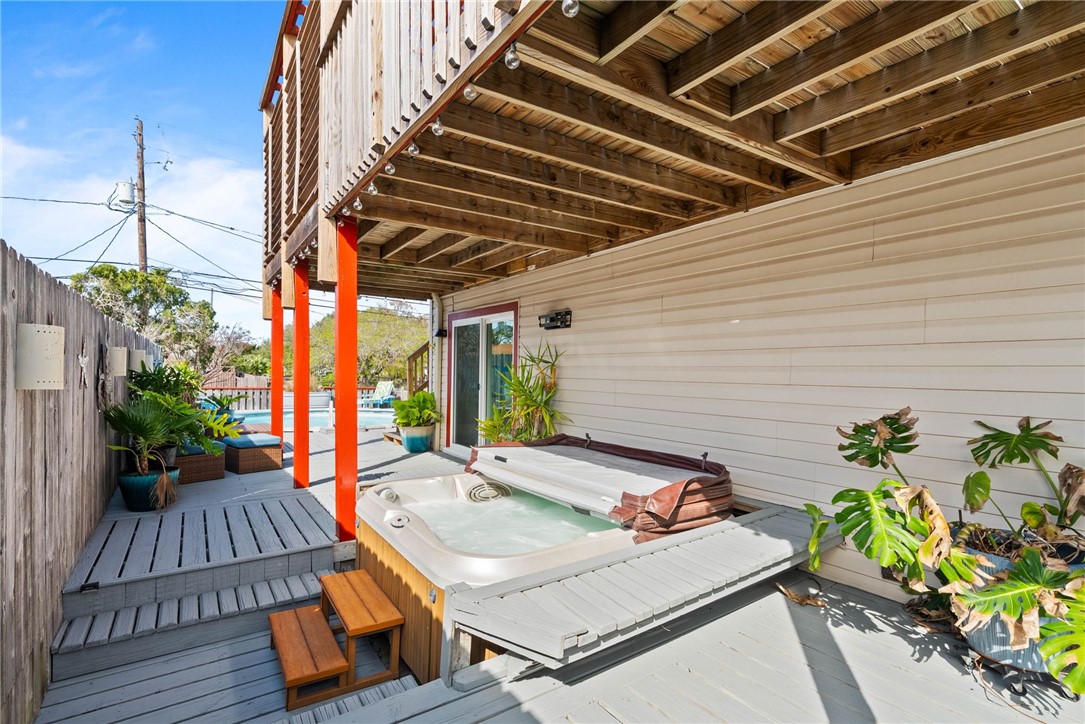 3211 Laguna Shores Road Corpus Christi, TX 78418 - Photo 24 of 29 a backyard of a house with table and chairs