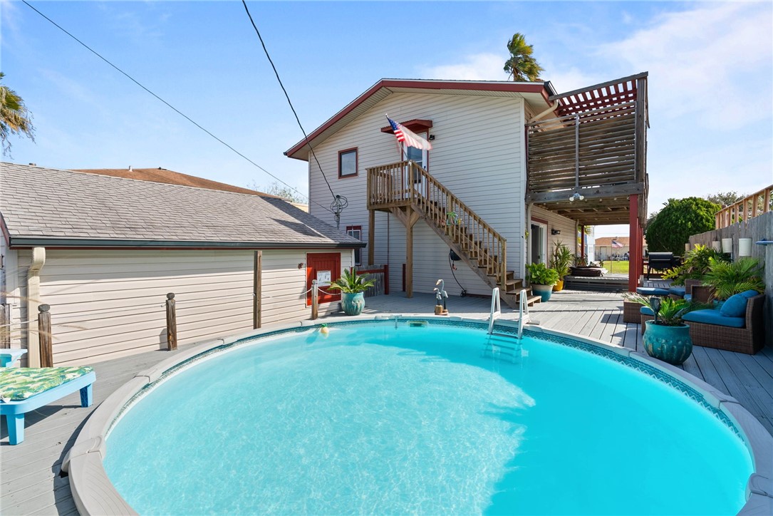 3211 Laguna Shores Road Corpus Christi, TX 78418 - Photo 5 of 29 a front view of a house with garden