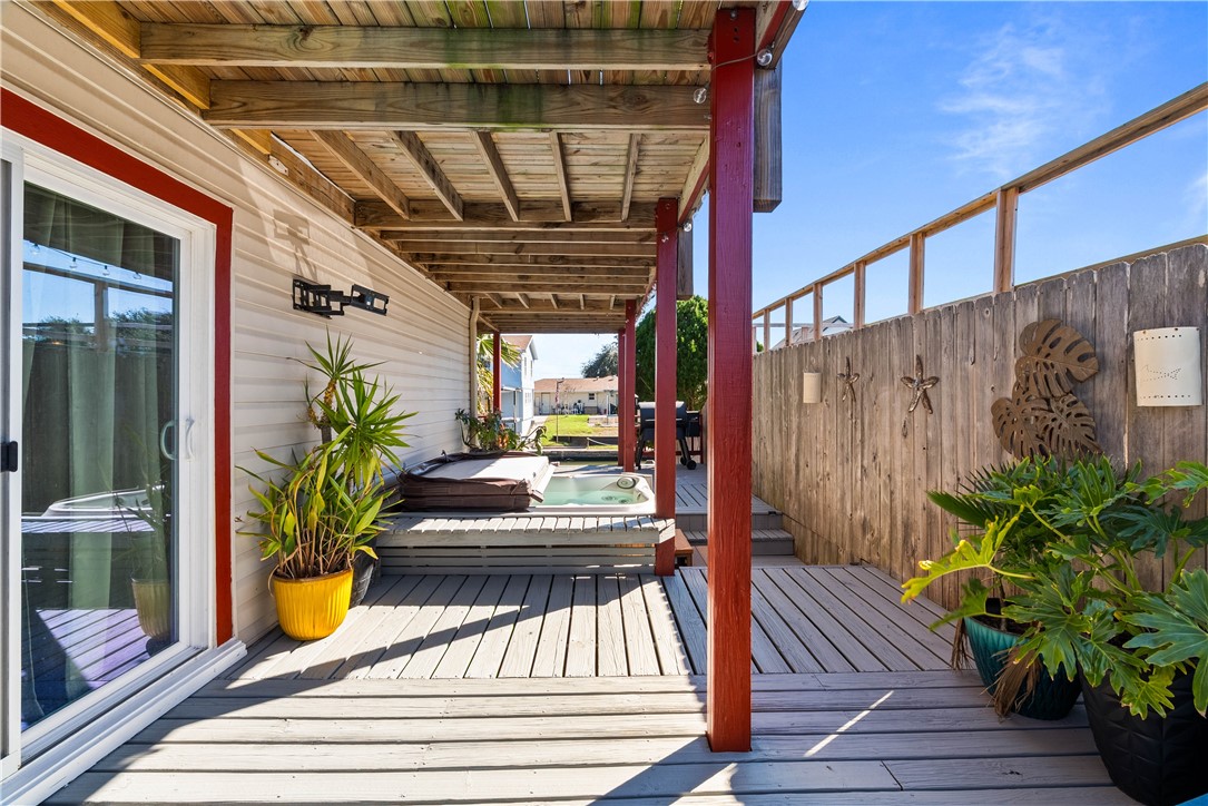 3211 Laguna Shores Road Corpus Christi, TX 78418 - Photo 9 of 29 a view of a porch with wooden floor