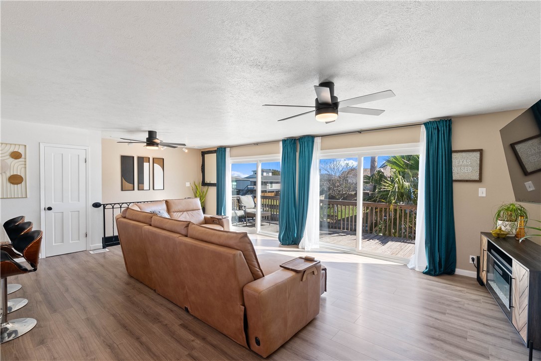3211 Laguna Shores Road Corpus Christi, TX 78418 - Photo 10 of 29 a living room with furniture and a large window