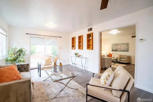 a dining room with furniture and window