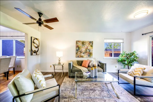 a living room with furniture and a rug