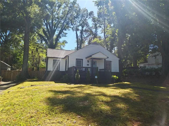 a house view with swimming pool in front of house
