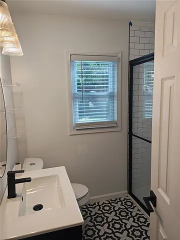 a bathroom with a sink toilet and vanity