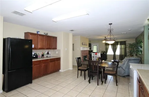 a kitchen with a sink a stove and cabinets