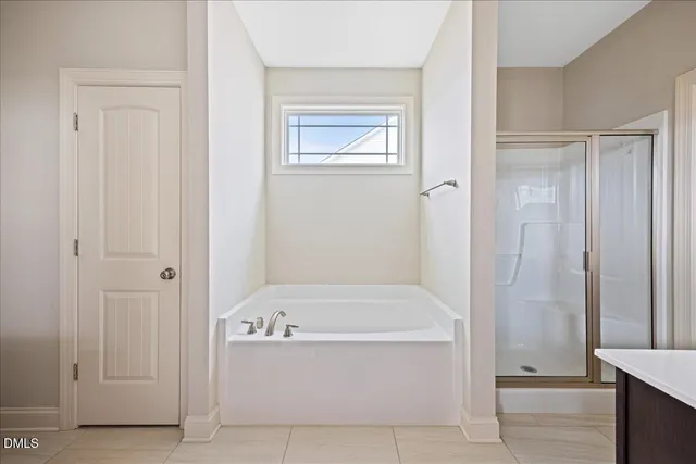 a white bath tub sitting in a bathroom