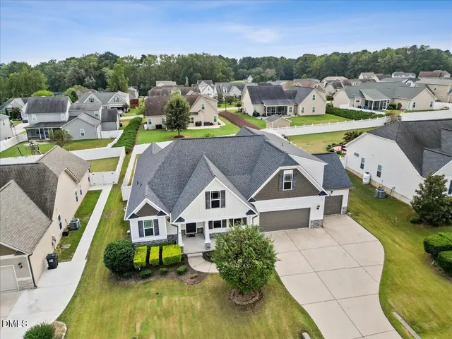 a aerial view of a house with a big yard