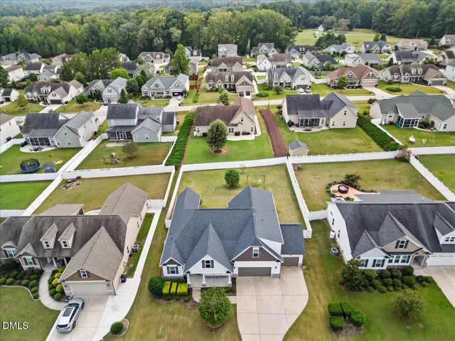 a view of multiple houses with outdoor space