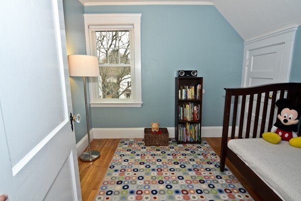51 Dexter Road Lexington, MA 02420 - Photo 9 of 12 a bedroom with a bed and wooden floor