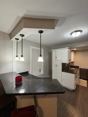 a kitchen with a counter space a sink and appliances