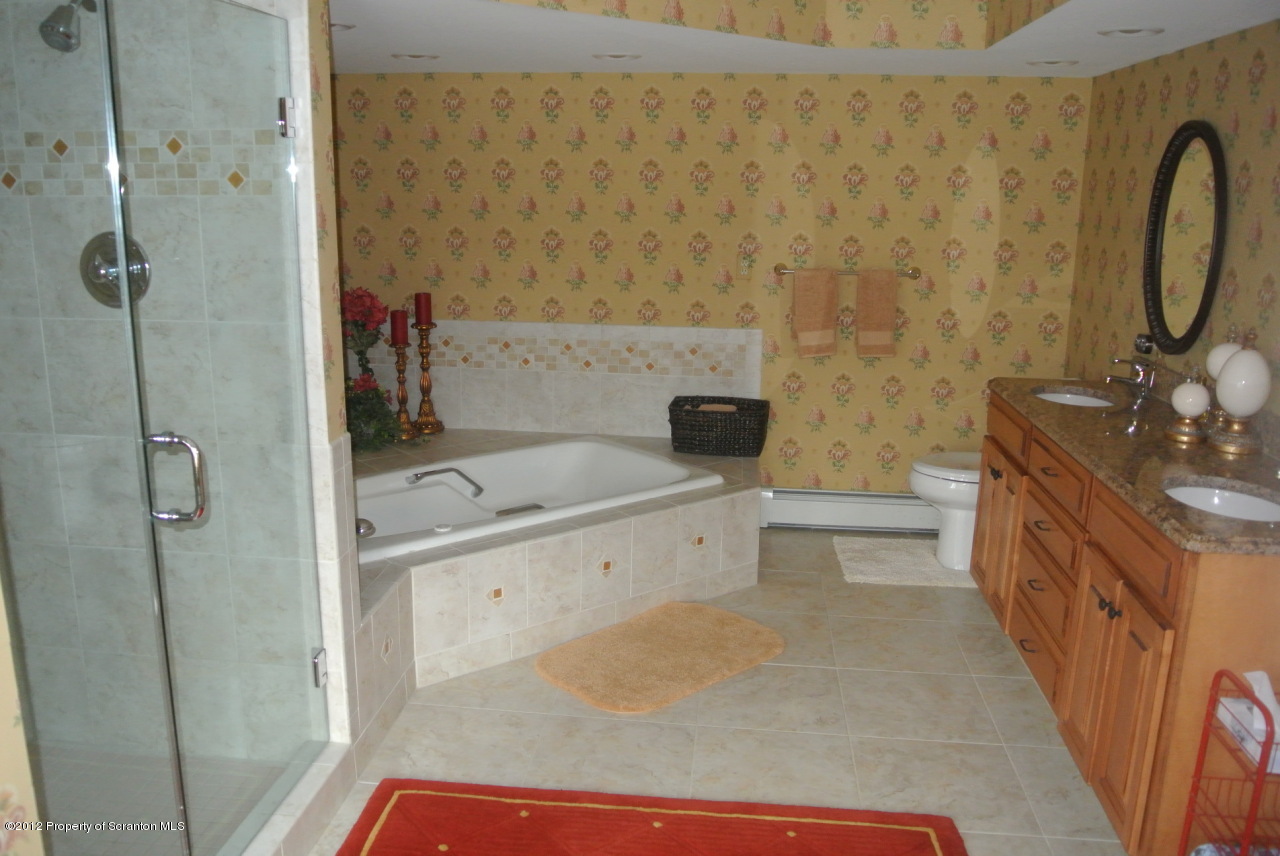 94 Lake Rd Lake Factoryville, PA 18419 - Photo 17 of 19 a bathroom with a tub sink toilet and shower