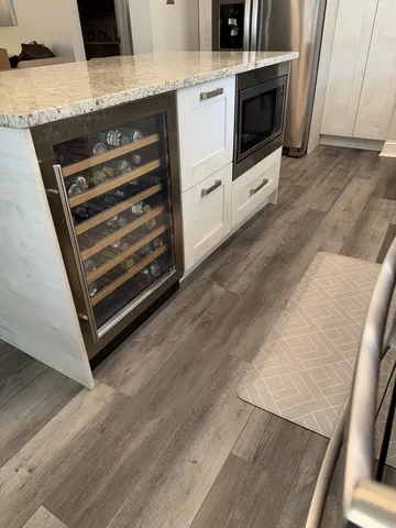 a stove top oven sitting inside of a kitchen