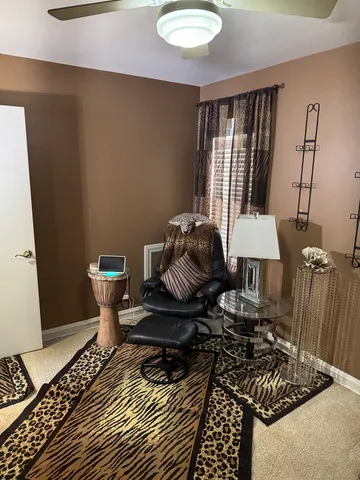 a bedroom with a bed and a mirror