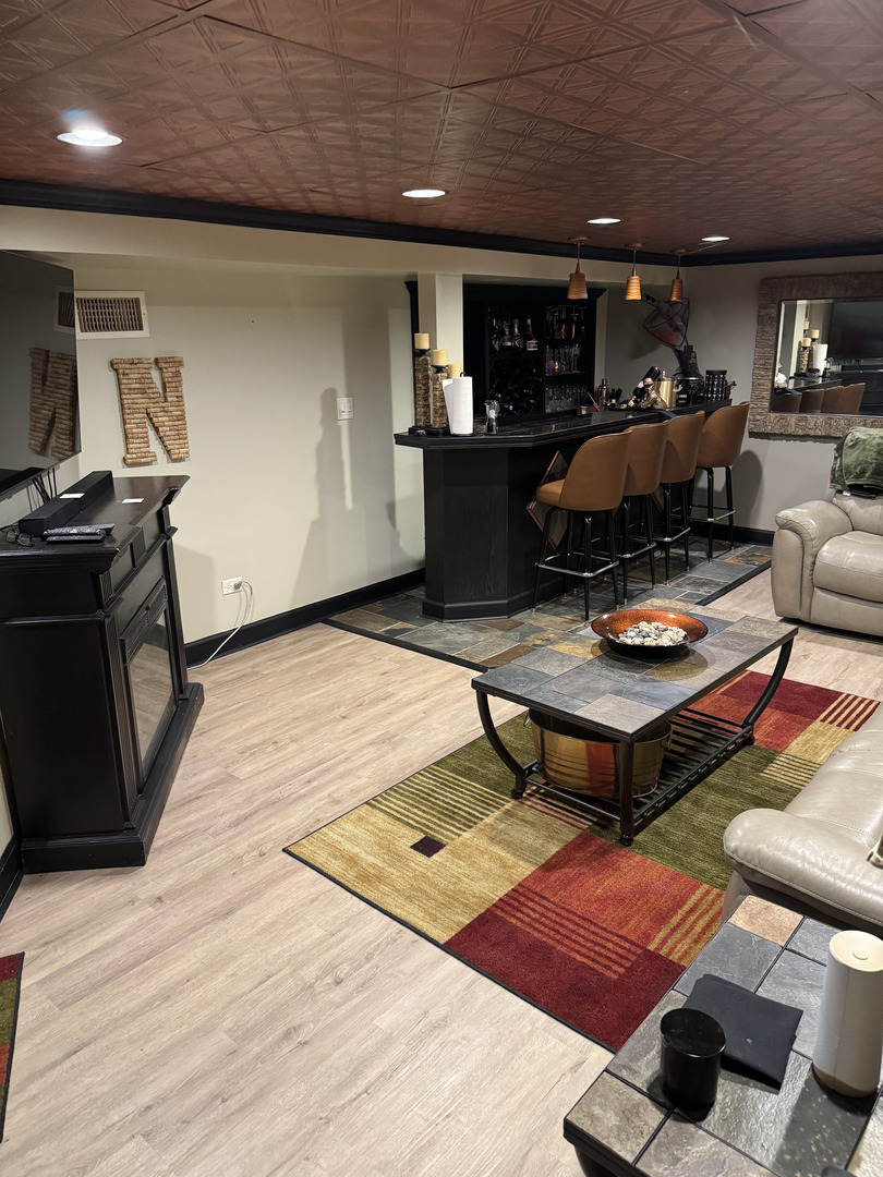 2527 Keystone Avenue North Riverside, IL 60546 - Photo 24 of 33 a living room with furniture and a wooden floor