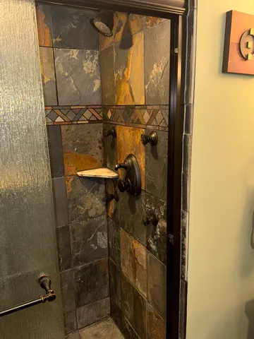 a bathroom with a sink toilet and mirror