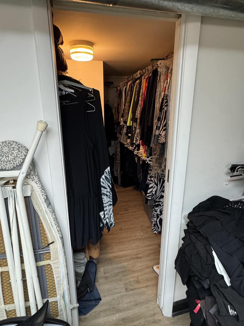 2527 Keystone Avenue North Riverside, IL 60546 - Photo 30 of 33 a view of walk in closet with clothes and shoes