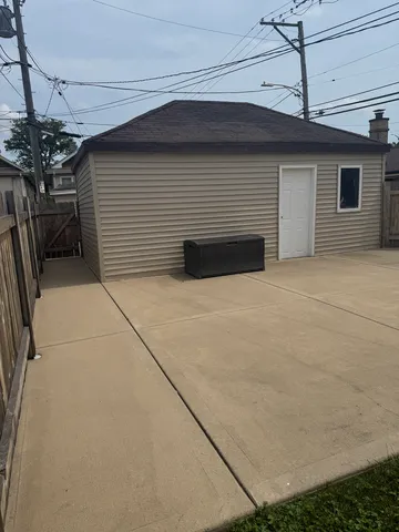 a view of a patio with table and chairs potted plants with wooden floor