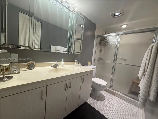 a spacious bedroom with a bed and a couch