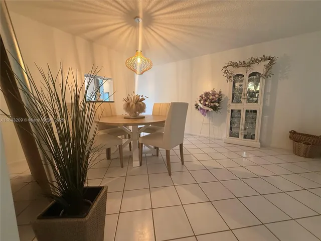 a view of a livingroom with furniture and chandelier