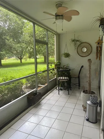 a view of a park with large trees