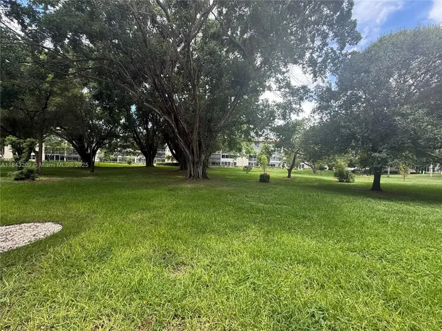 a kitchen with stainless steel appliances granite countertop a stove and a refrigerator