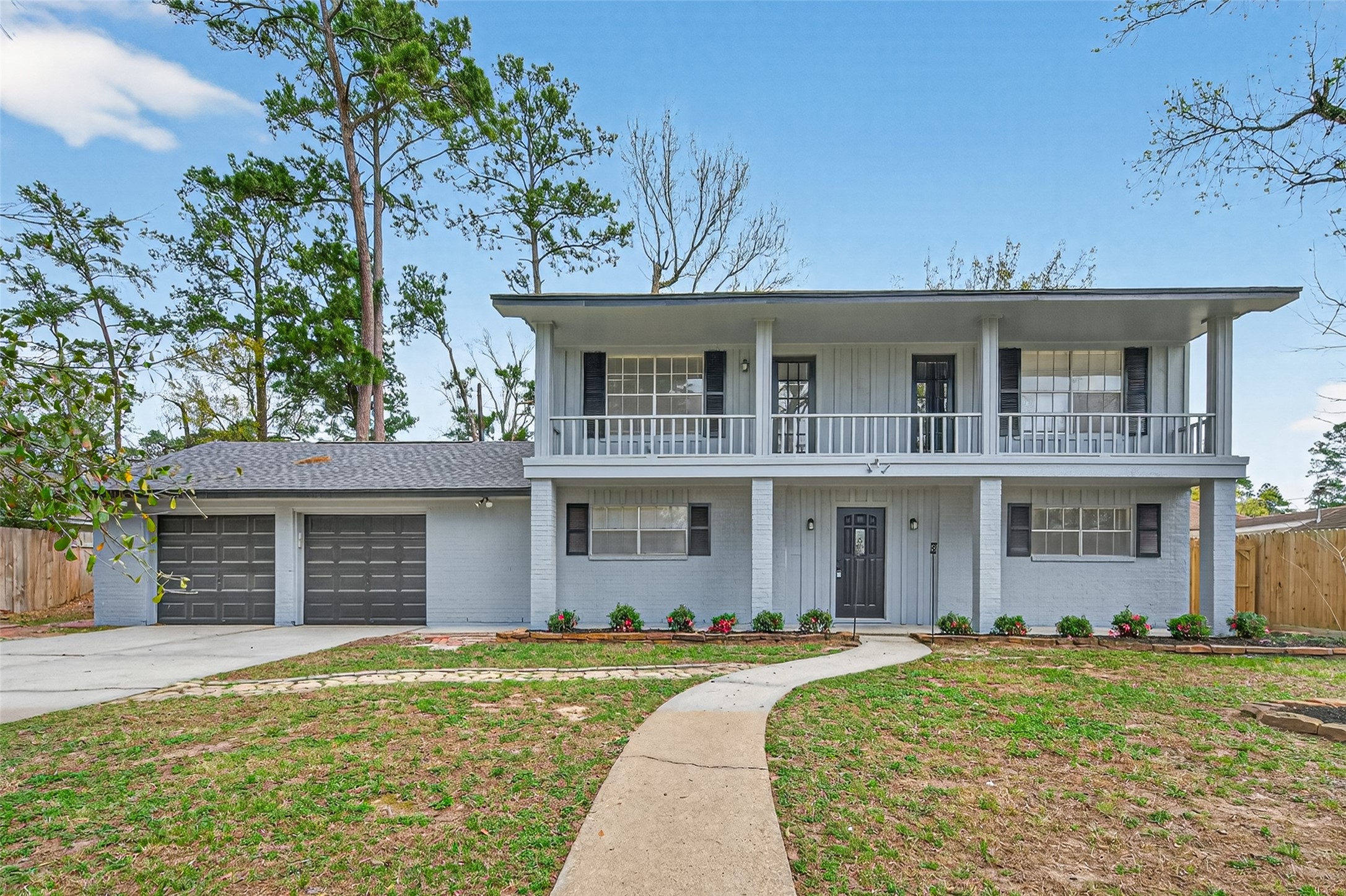 front view of a house with a yard