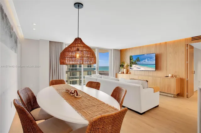 a living room with furniture a rug and a flat screen tv