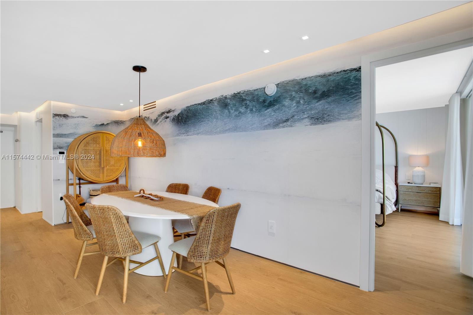 9195 Collins Avenue, Unit 903 Surfside, FL 33154 - Photo 17 of 51 a view of a room with furniture and wooden floor