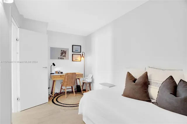 a bedroom with a bed and gym equipment