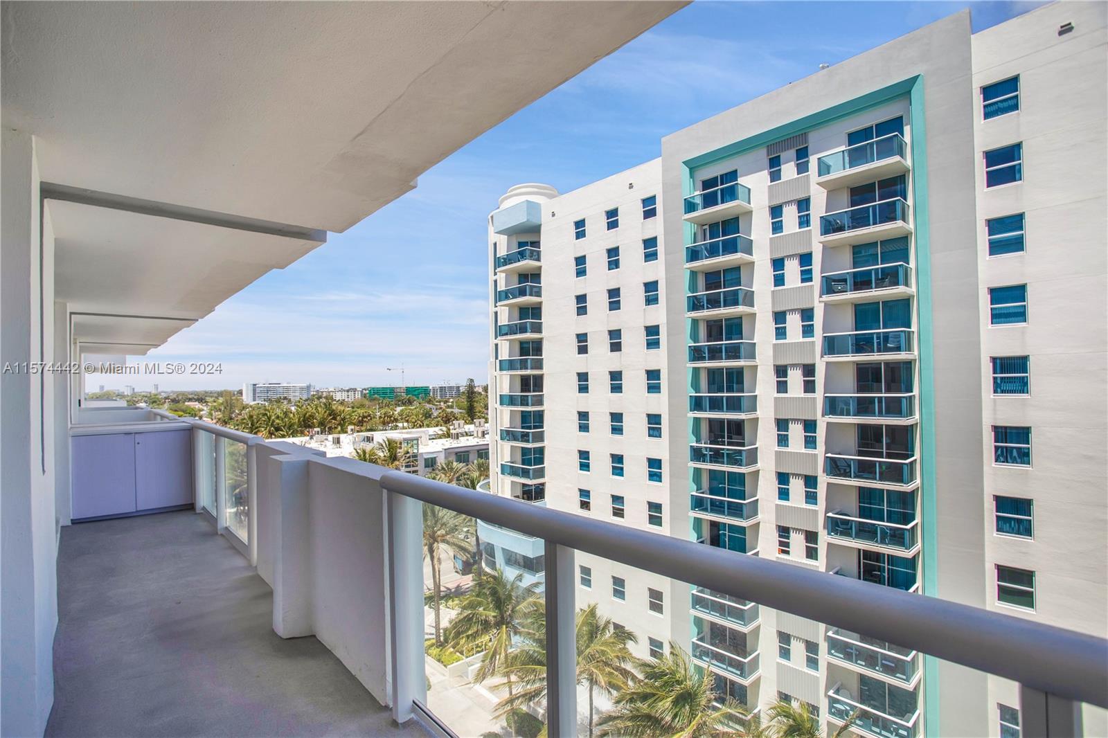 9195 Collins Avenue, Unit 903 Surfside, FL 33154 - Photo 41 of 51 a view of a large building from a balcony