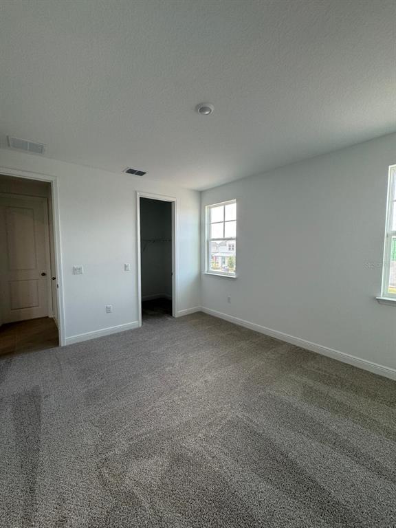 10070 Fiddley Alley Orlando, FL 32827 - Photo 9 of 10 a view of an empty room with windows