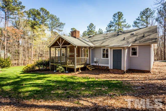 6916 Laurdane Road Raleigh, NC 27613 - Photo 22 of 23 a view of a house with a yard