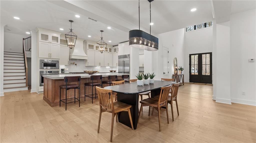 165 Highlands Chase Ball Ground, GA 30107 - Photo 11 of 40 a large kitchen with a table and chairs
