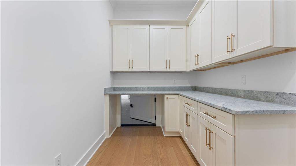 165 Highlands Chase Ball Ground, GA 30107 - Photo 18 of 40 a view of a kitchen with granite countertop cabinets