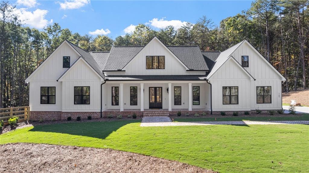 165 Highlands Chase Ball Ground, GA 30107 - Photo 35 of 40 a front view of a house with a yard and porch
