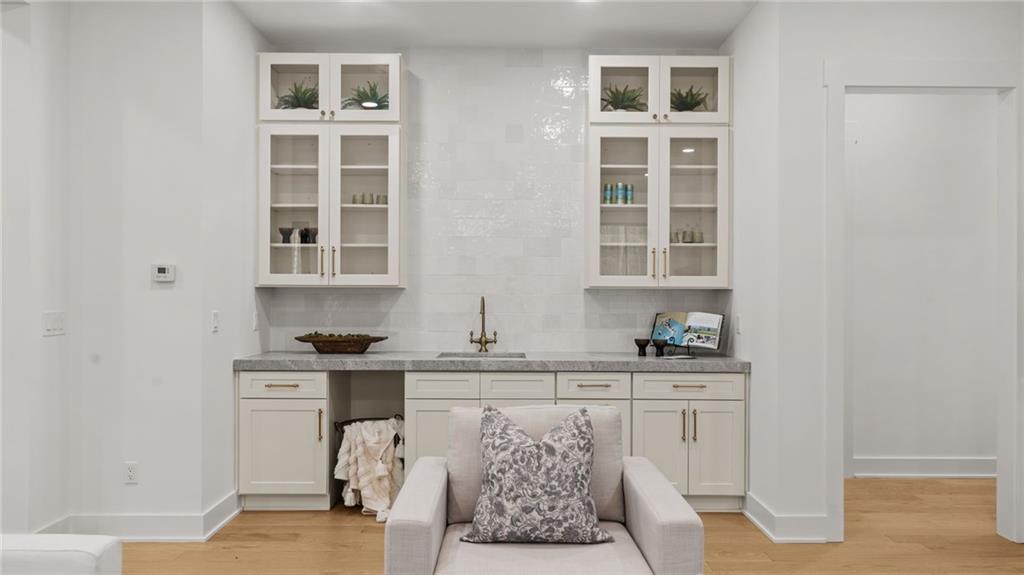 165 Highlands Chase Ball Ground, GA 30107 - Photo 8 of 40 a view of cabinets a window and chairs