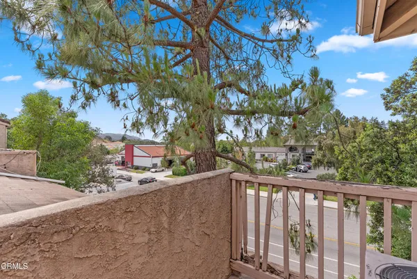 a view of a street from a balcony