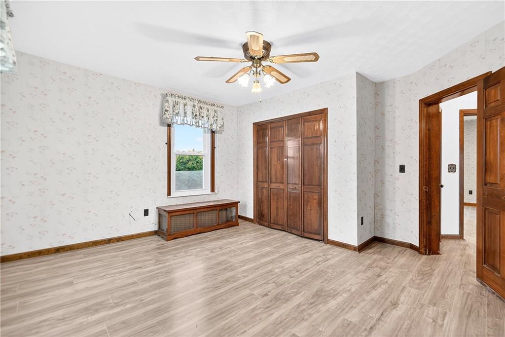 815 Washington Road Belle Vernon, PA 15012 - Photo 28 of 50 a view of an empty room with window and wooden floor