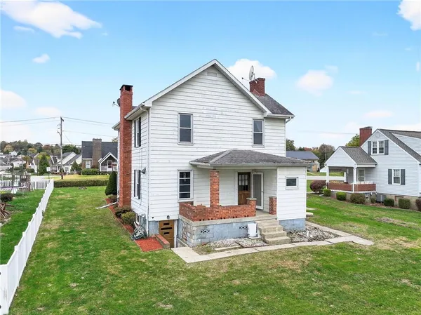 a front view of house with a yard