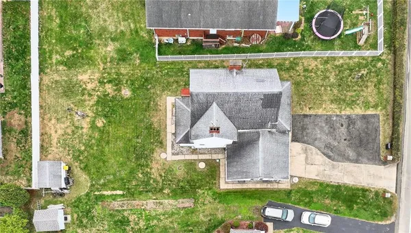 an aerial view of a house with garden space sitting space and swimming pool