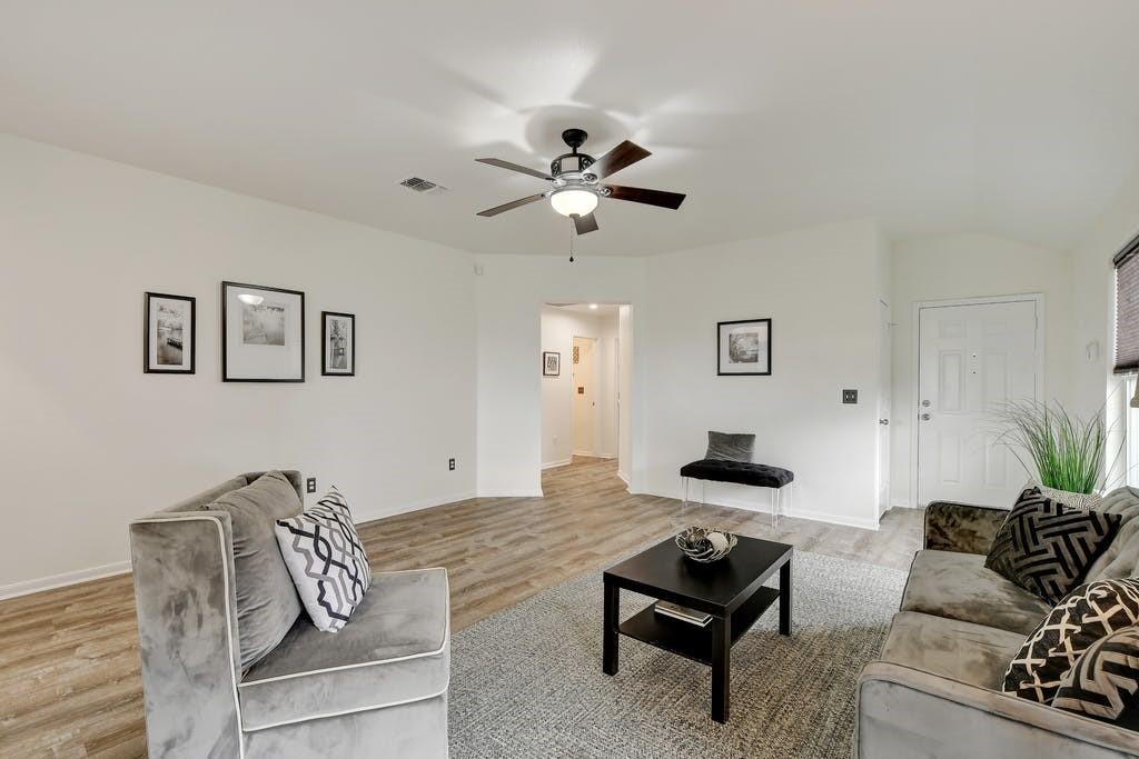 173 Rafe Court Kyle, TX 78640 - Photo 10 of 27 Living area with light wood-style flooring and ceiling fan