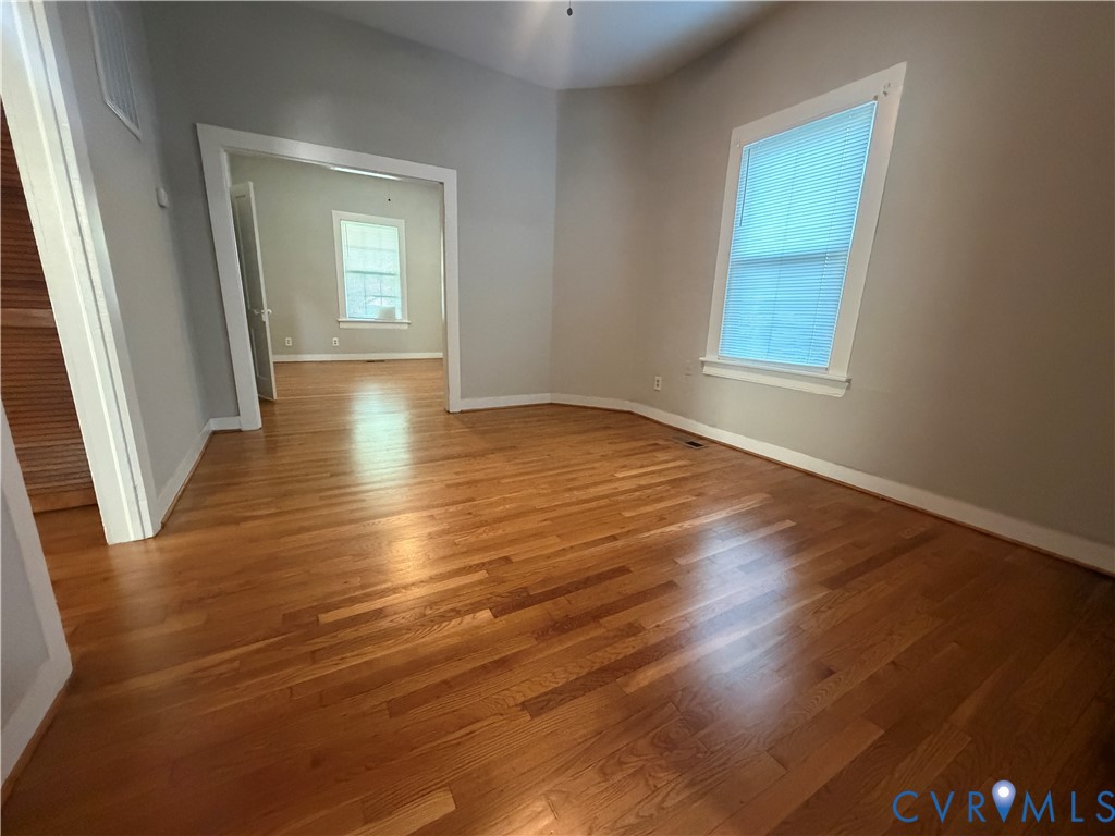 29 Spring Street Petersburg, VA 23803 - Photo 11 of 15 Hardwood flooring, painted walls, vaulted ceiling,