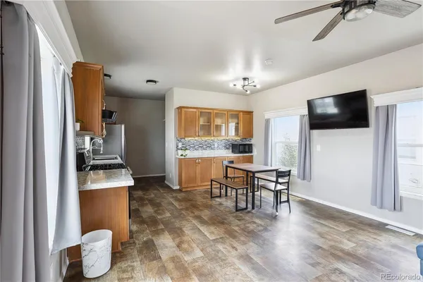 a dining room with furniture and window