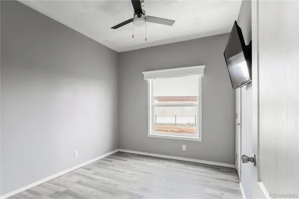 a view of an empty room with a flat screen tv