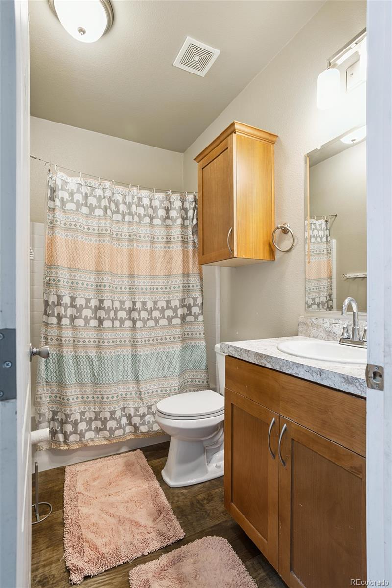 125 12th Street Fairplay, CO 80440 - Photo 18 of 31 a bathroom with a granite countertop toilet sink and mirror